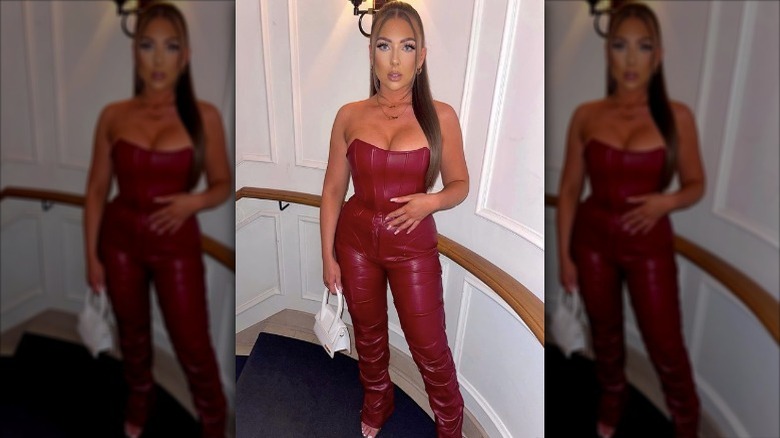 woman wearing red leather bustier