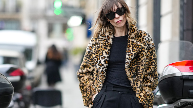 Model wearing cheetah coat