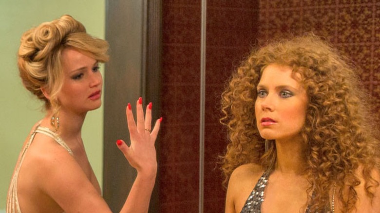 Jennifer Lawrence and Amy Adams, who shared an unscripted kiss in American Hustle