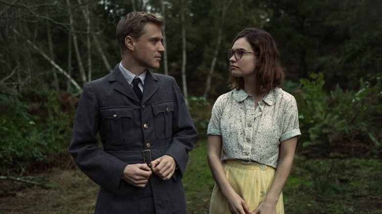 Lily James and Johnny Flynn smiling