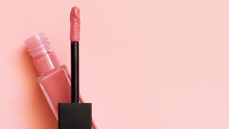 A tube of brightly colored lip gloss on display