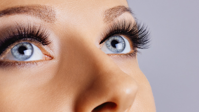 Woman with gray eyes and eye makeup