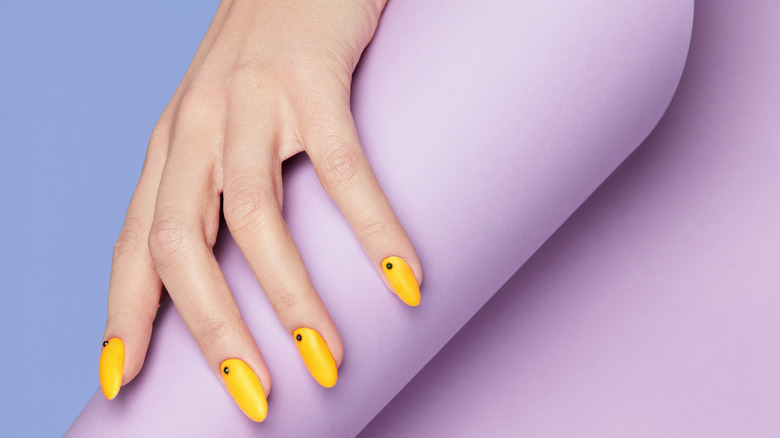 Nail art with yellow polish 