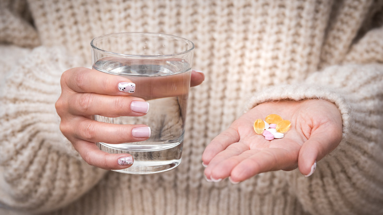 woman taking vitamins