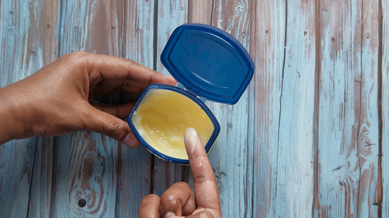 A person using petroleum jelly