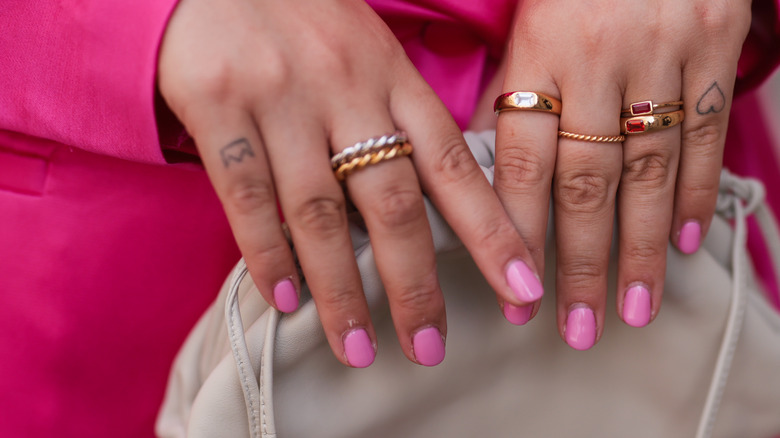 Hands with bubblegum pink nails 