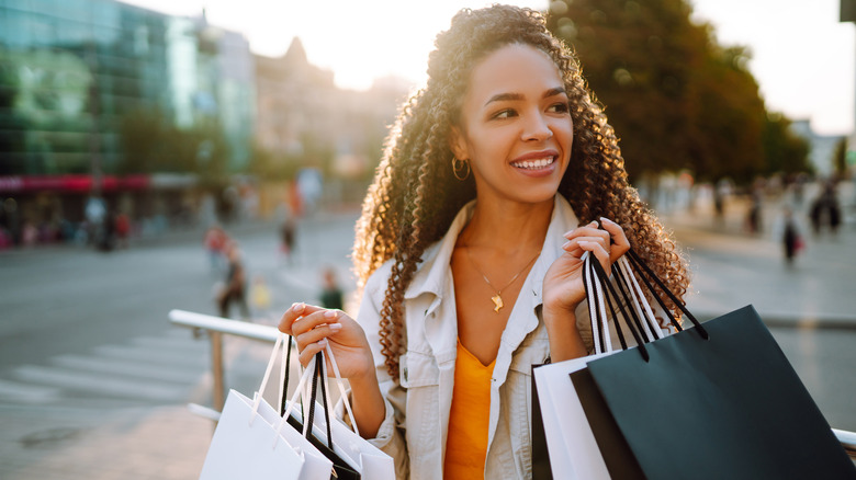 Woman carries shopping bags