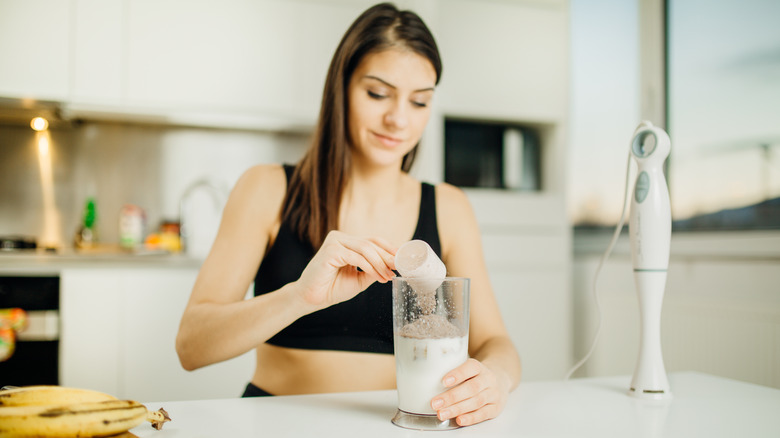 Woman making a protein shake