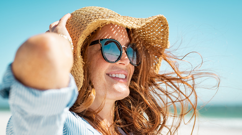 Woman in hat and sunglasses