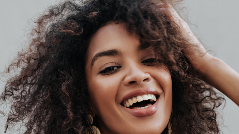 A woman with curly hair 