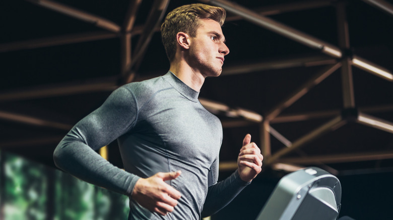 man running on treadmill