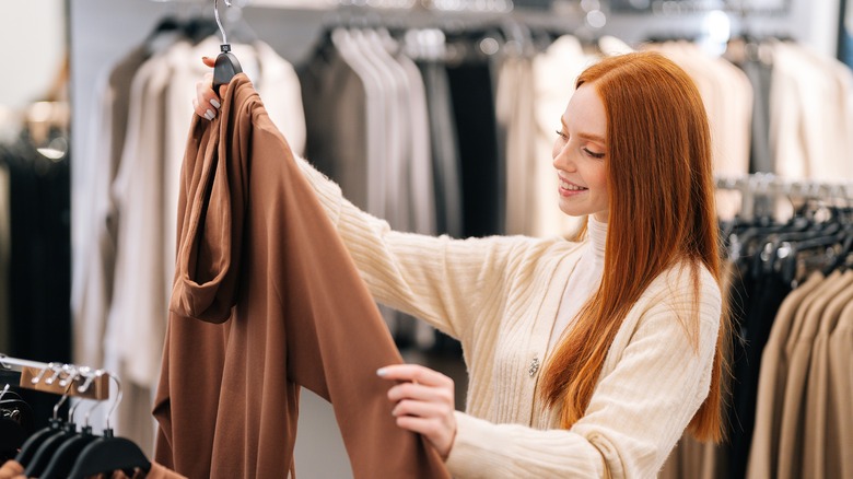 Woman smiling whilst browsing