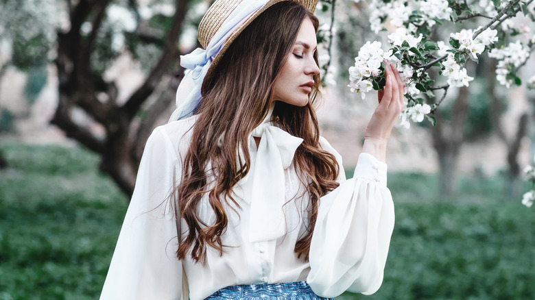 Woman in flowy white blouse