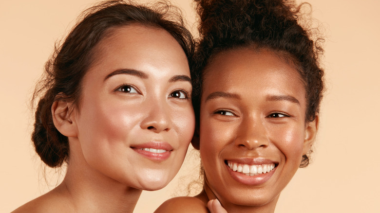 Two women with glowing skin