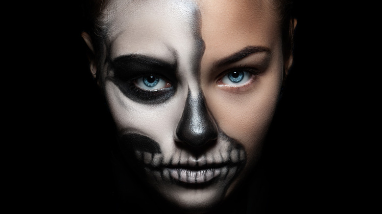 Woman wearing skull makeup