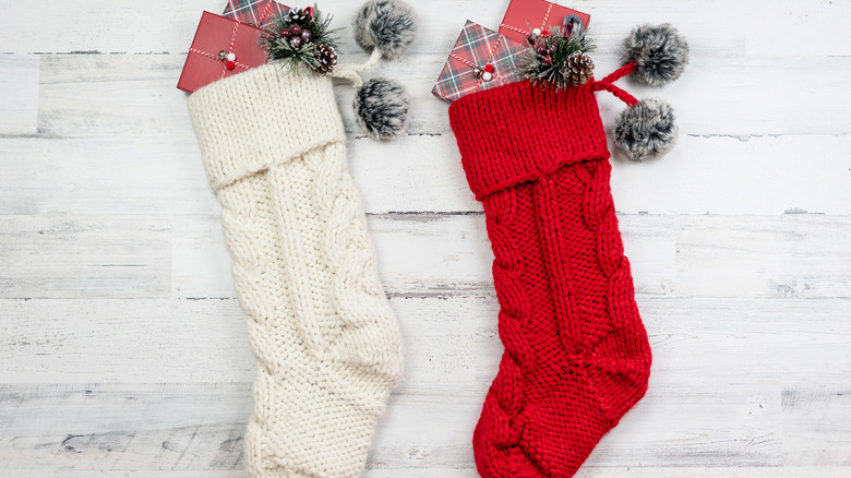 Stuffed stockings hanging on wall