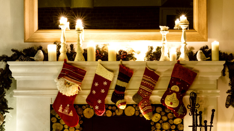 Christmas stockings hanging in front of a fire