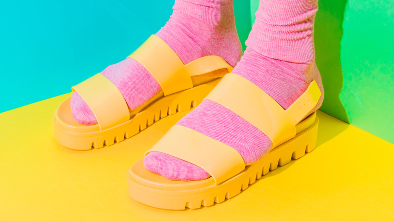 Pink socks with yellow sandals