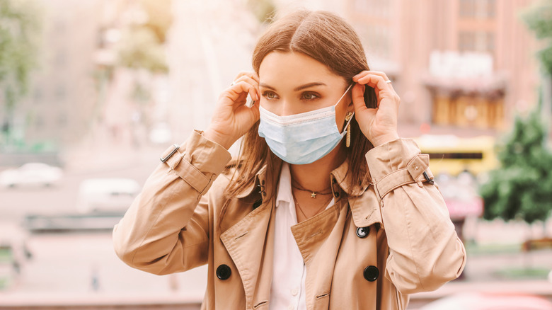 Stylish woman in mask