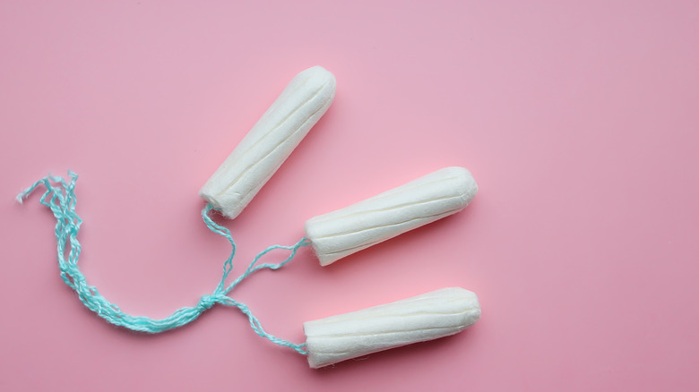 three tampons tied together