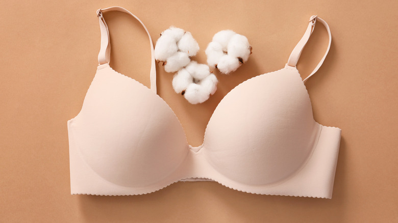 Neutral-colored bra with flowers around it