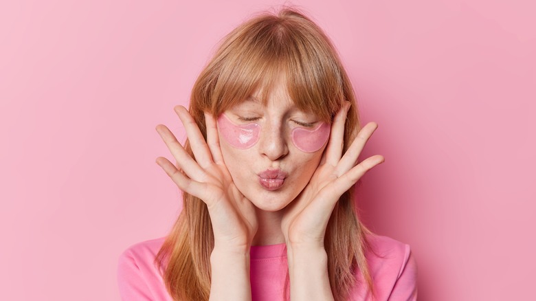 Woman with pink patches under her eyes