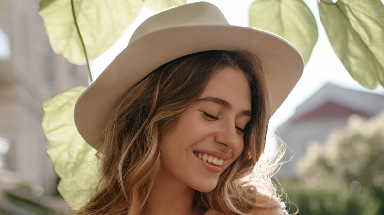 Smiling woman wearing hat