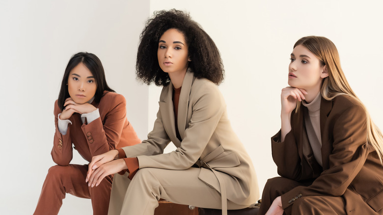 Three women in suits and heels
