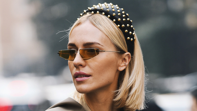 woman with sunglasses wearing headband 