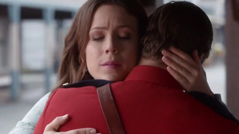 Erin Krakow hugging a red-uniformed man