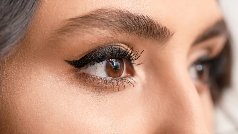 Woman showing winged eyeliner