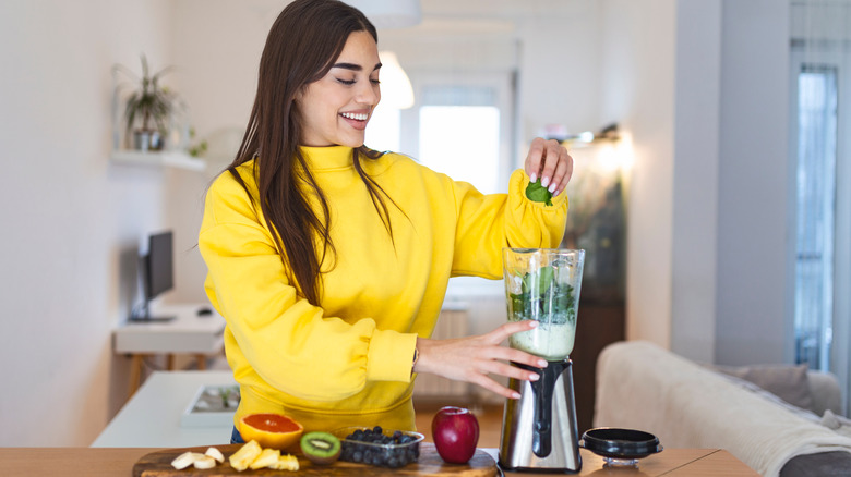 Woman making smoothie