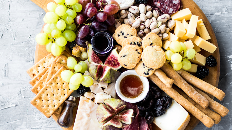 A bountiful charcuterie board on a wooden board