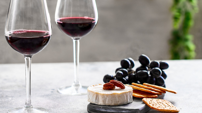 Charcuterie foods with glasses of wine