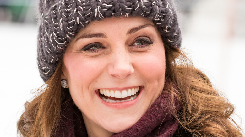 Kate Middleton smiles for a photo. 