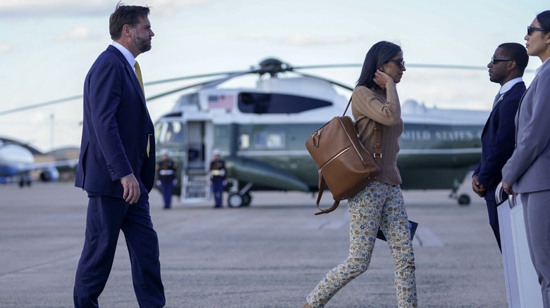 JD Vance walks after Usha Vance
