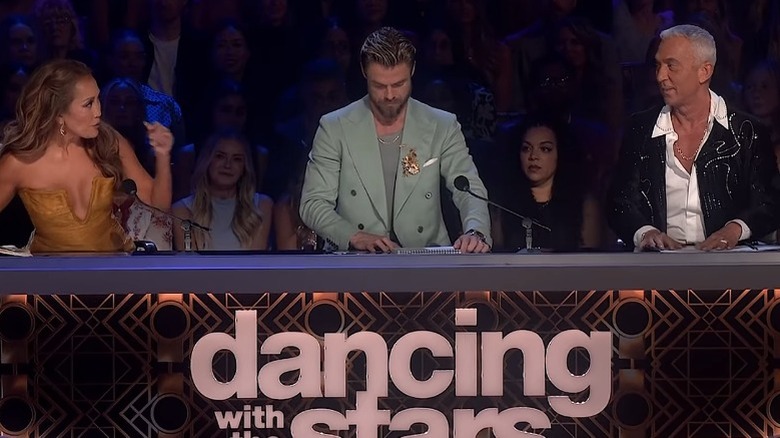 "Dancing with the Stars" judges Carrie Ann Inaba, Derek Hough, and Bruno Tonioli discussing feedback following a routine