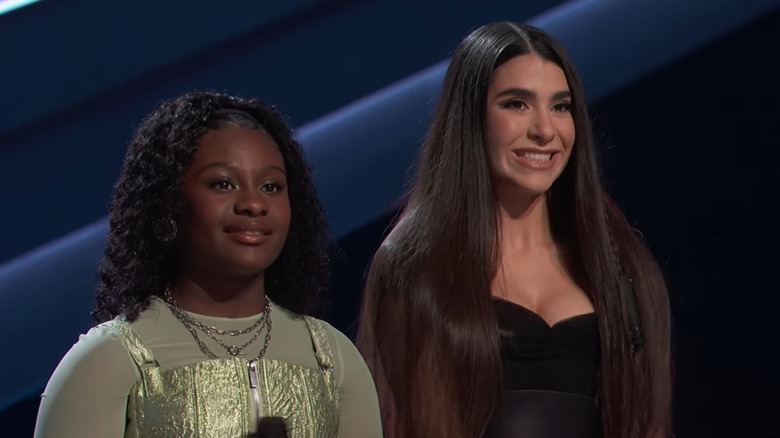 Brianna Cameron and Saade listening to the coaches' reviews of their battle performance on The Voice.