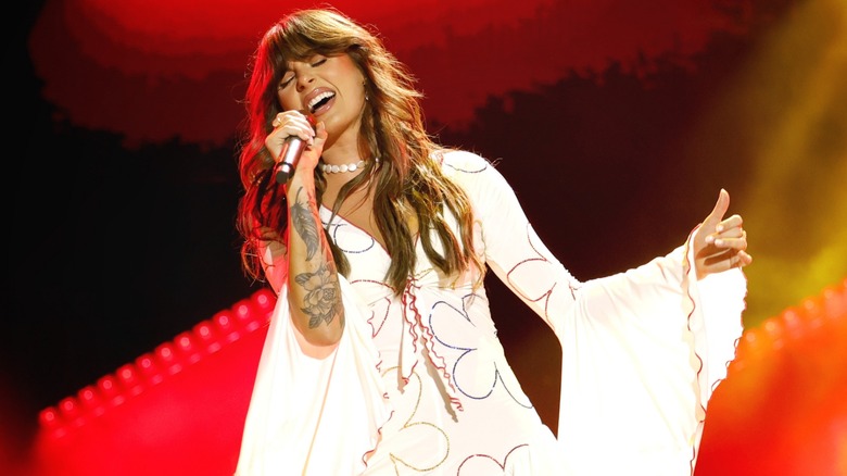 Ella Langley in a white dress belting onstage at CMA Fest in 2026.