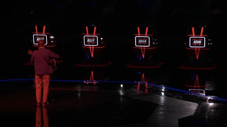 The Voice chairs turned away from a performer onstage.