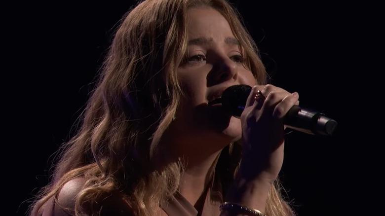 Julia Clark singing on the "The Voice" Season 30.