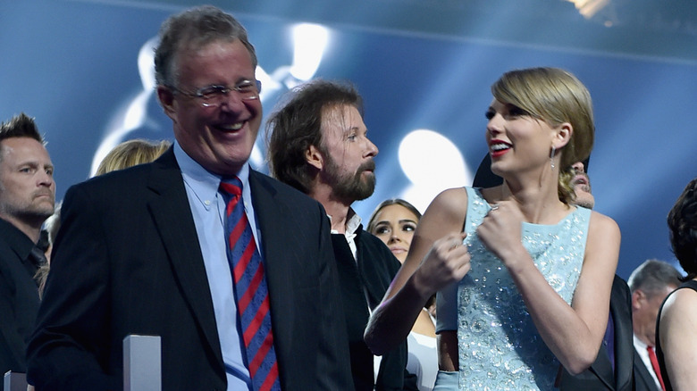Scott Swift and Taylor Swift laughing