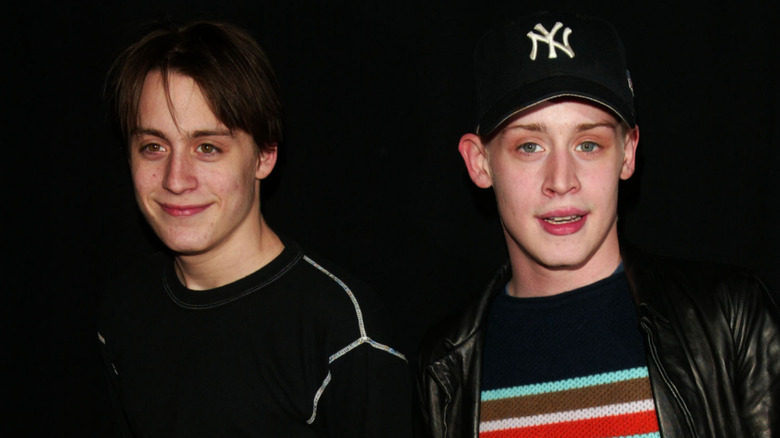 Kieran Culkin smiling next to Macaulay Culkin