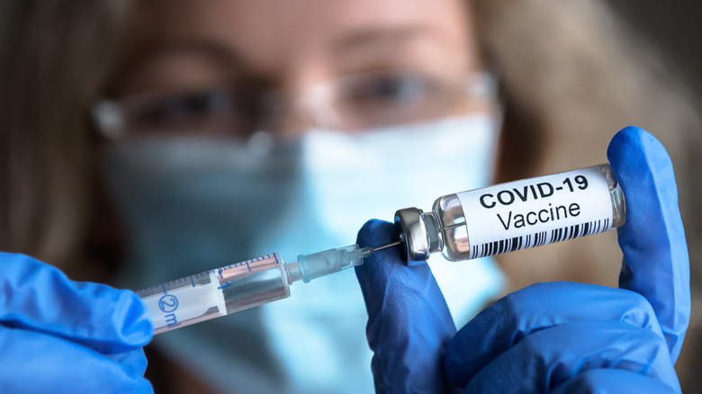 Scientist holding COVID-19 vaccine