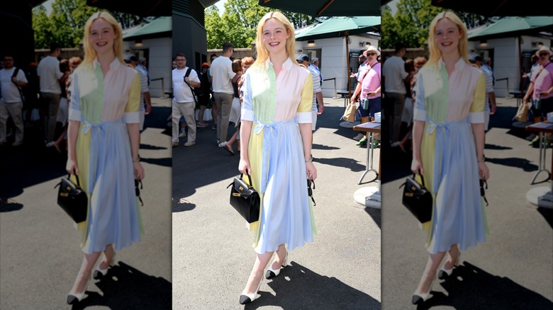 Elle Fanning smiles in a pastel outfit