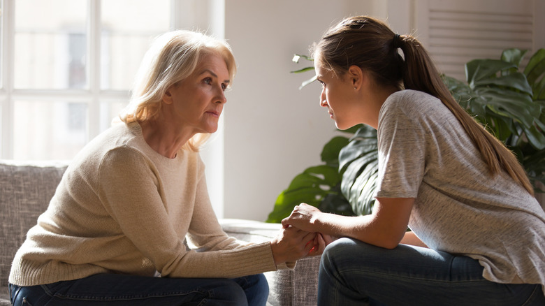 A mother and daughter having a serious discussion