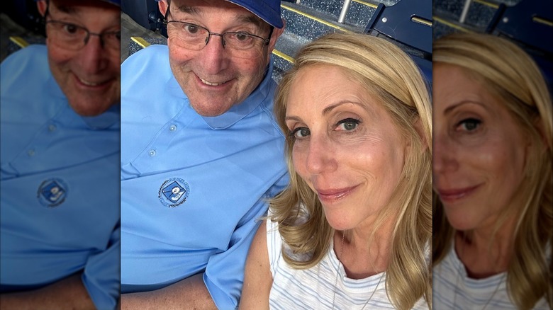 Dana Bash wearing black eyeliner and sitting next to her father in a baseball stadium