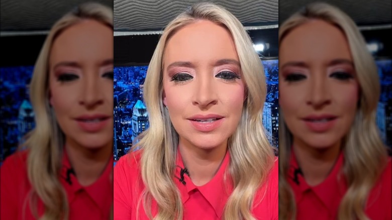 Kayleigh McEnany filming herself with pink eyeshadow, dark eyeliner, and long fake eyelashes