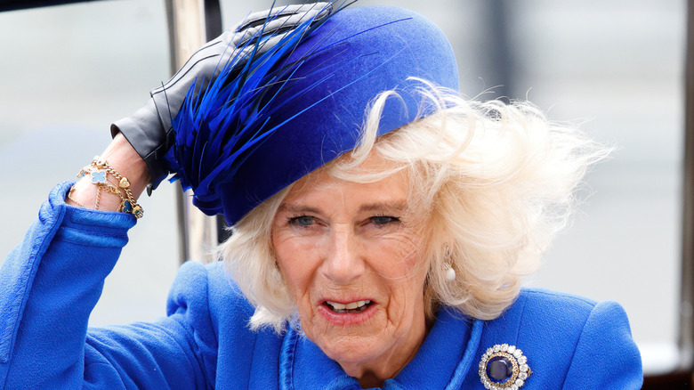Queen Camilla holding onto her hat on Commonwealth Day at Westminster Abbey, 2023.