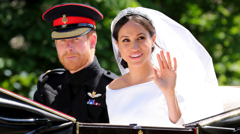 Prince Harry and Meghan Markle on a carriage on their wedding day in 2018.